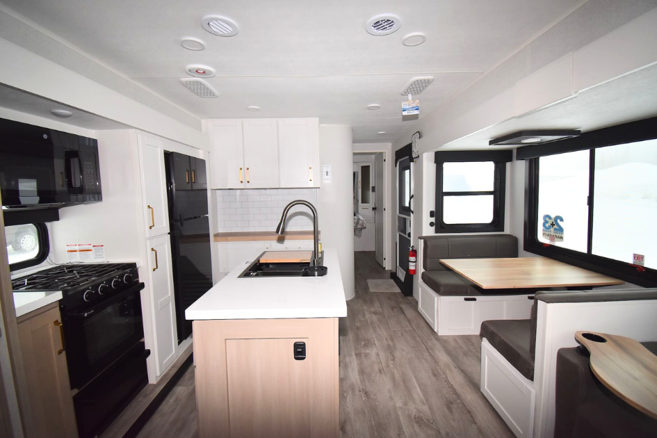 A spacious Jayco Eagle HT TT 312BHOK floorplan as seen from the kitchen with all the amenities of home, perfect for seasonal camping