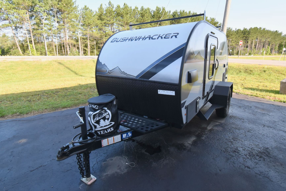 The Braxton Creek Bushwhacker parked in a lot next to a field.