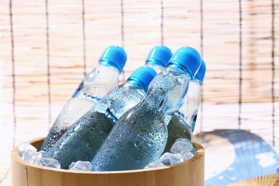 A bucket filled with ice cold water bottles ready for camping.